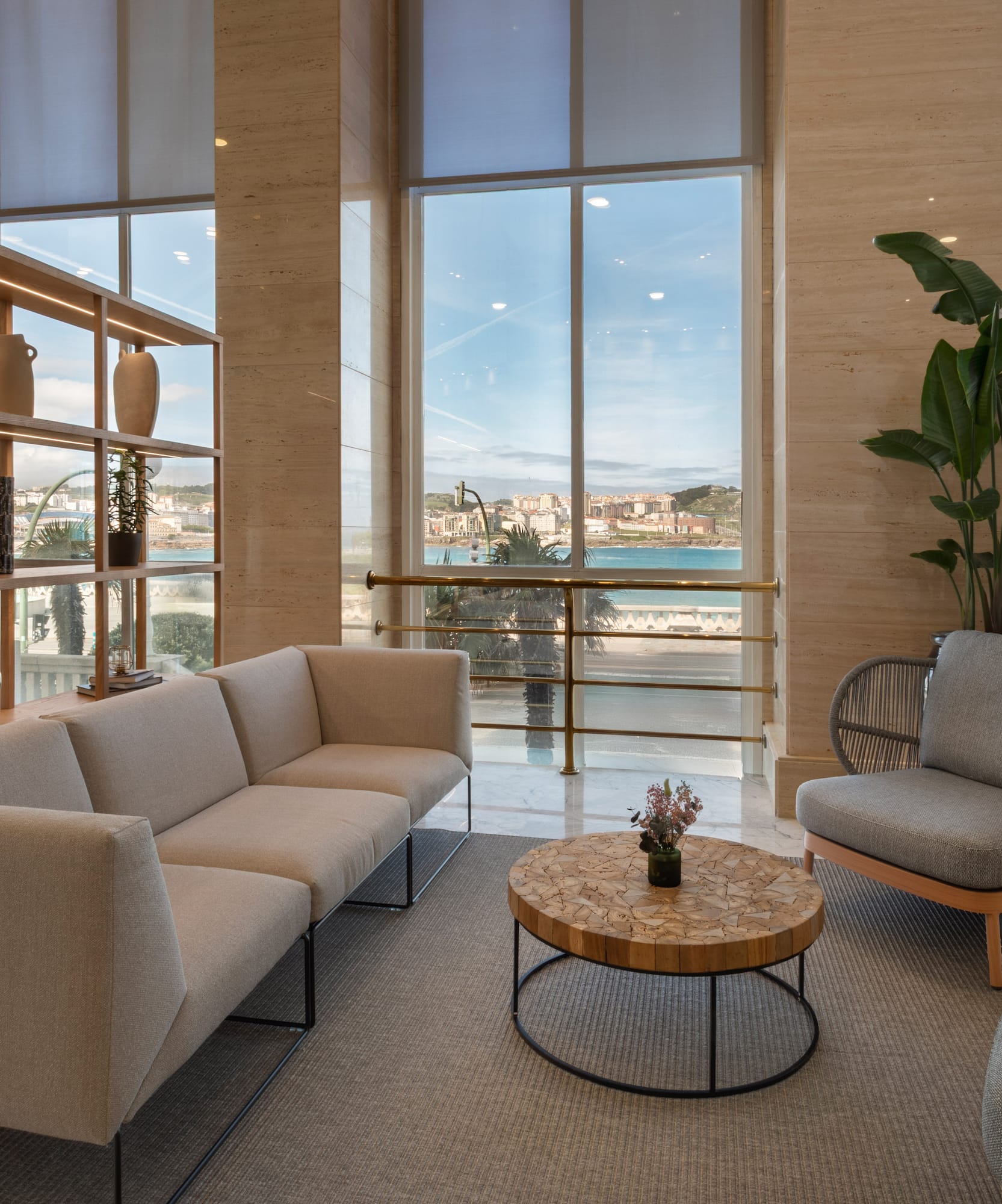 a room with a couch and chairs