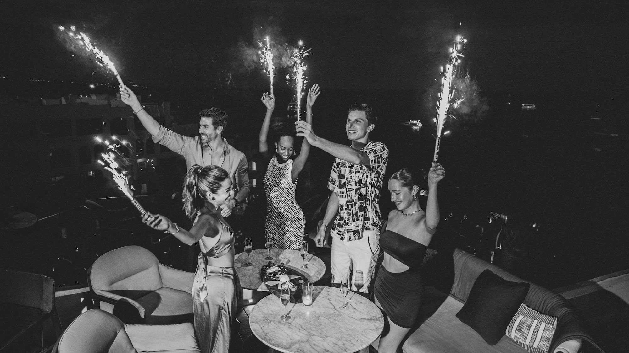 a group of people holding sparklers