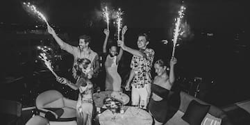 a group of people holding sparklers