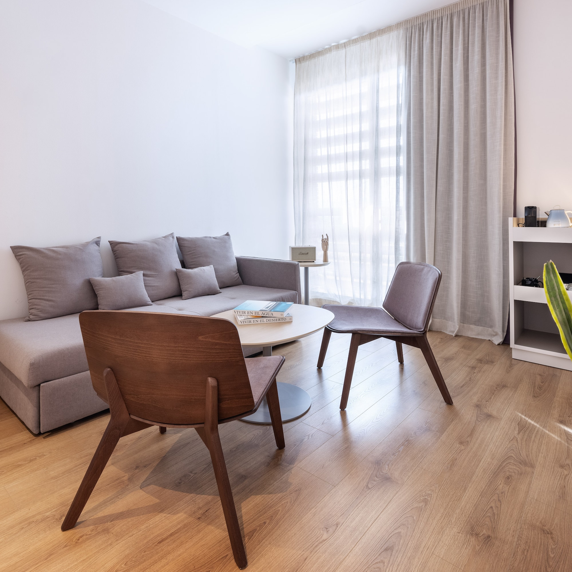 a living room with a couch and chairs