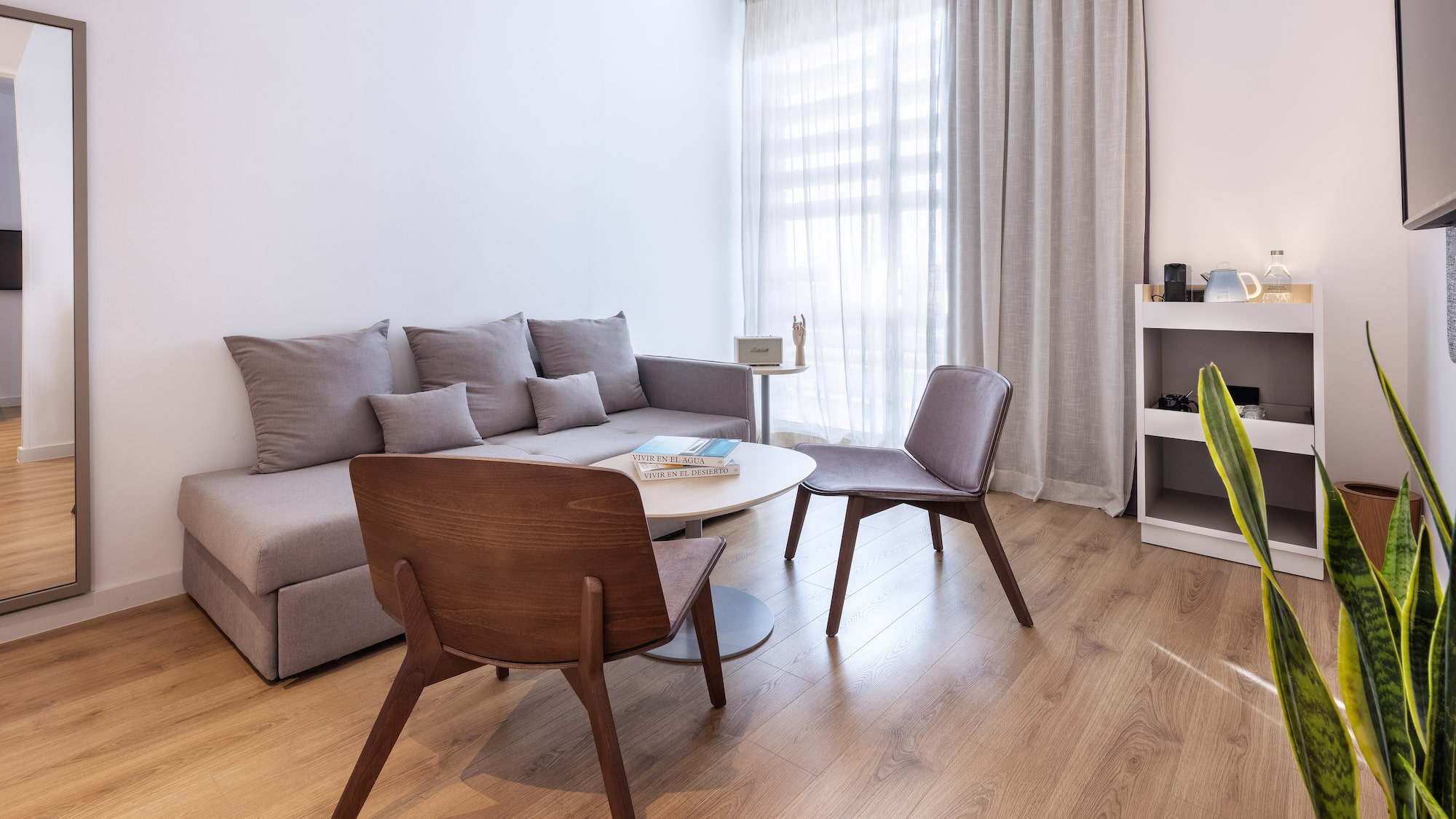 a living room with a couch and chairs