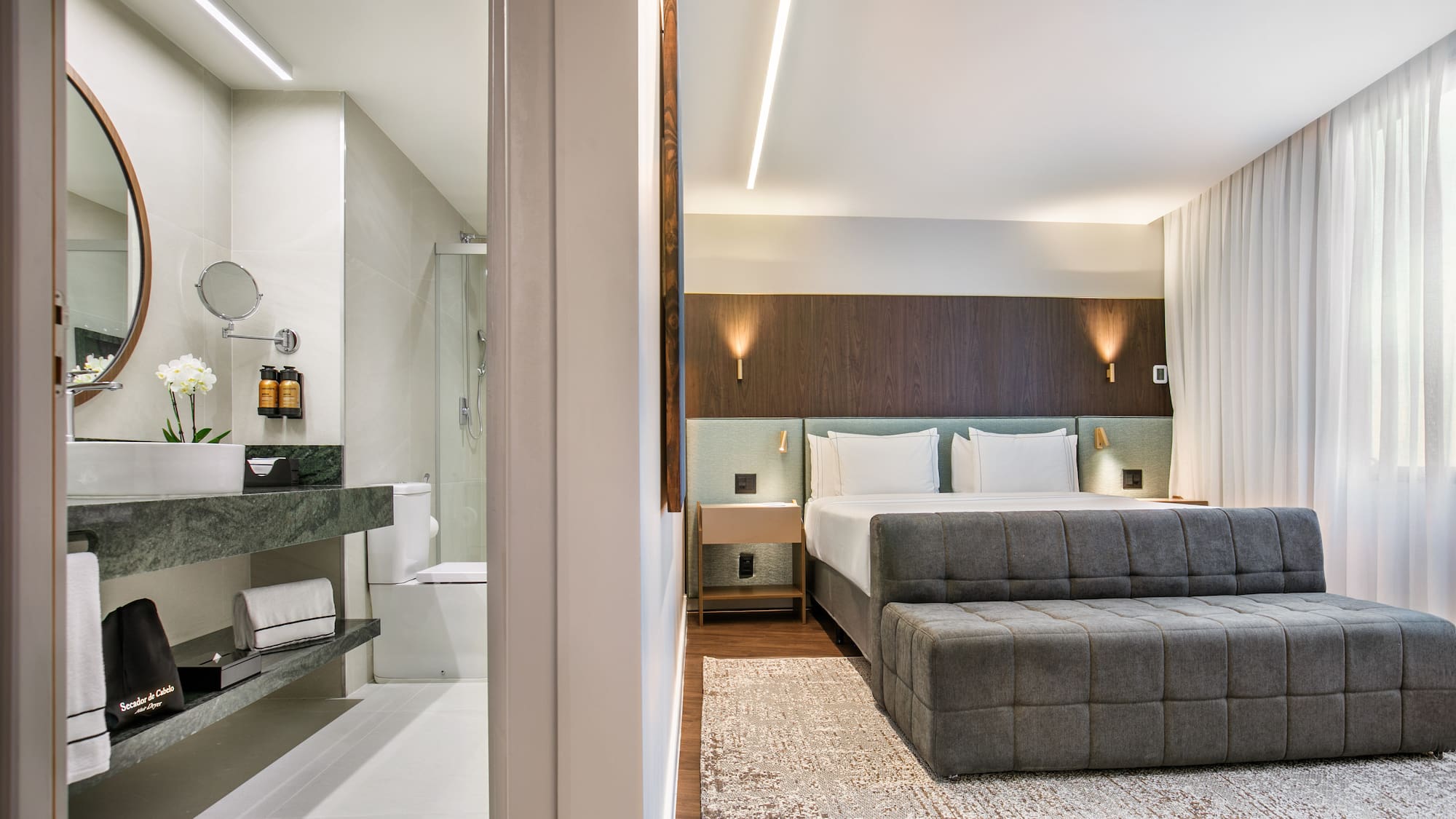 a bedroom with a bed and a sink