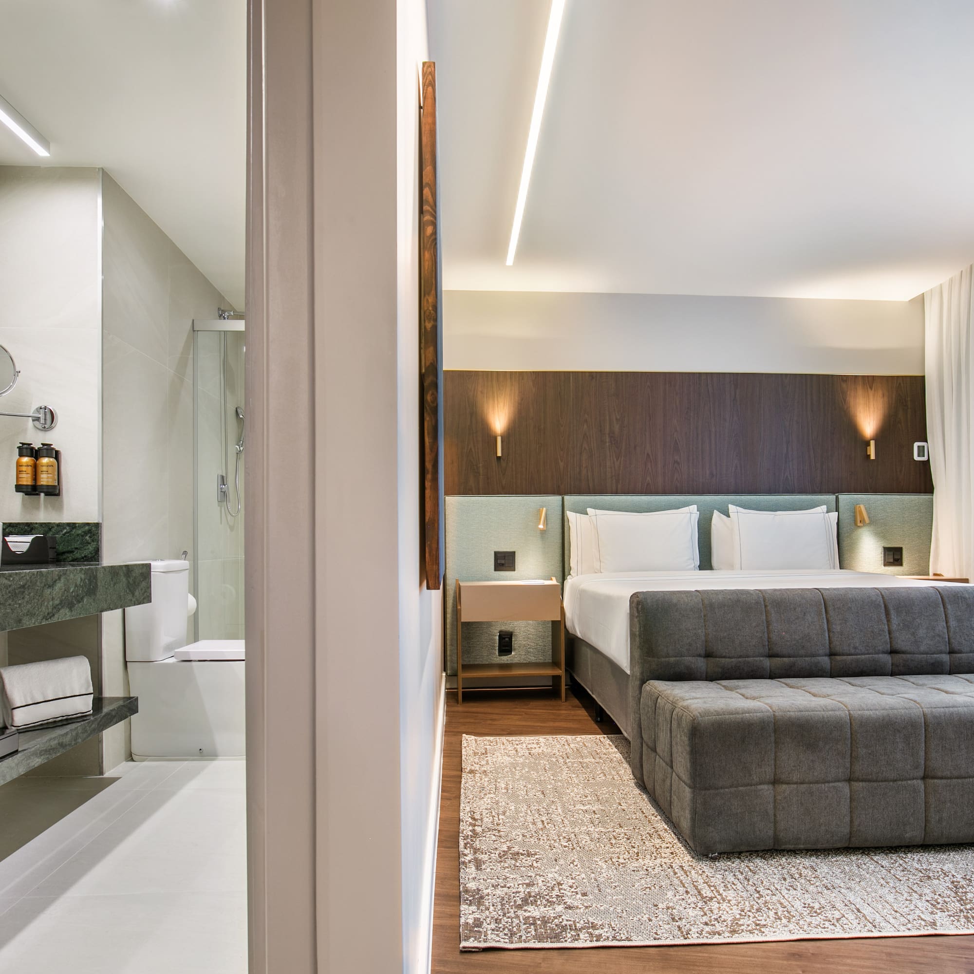 a bedroom with a bed and a sink