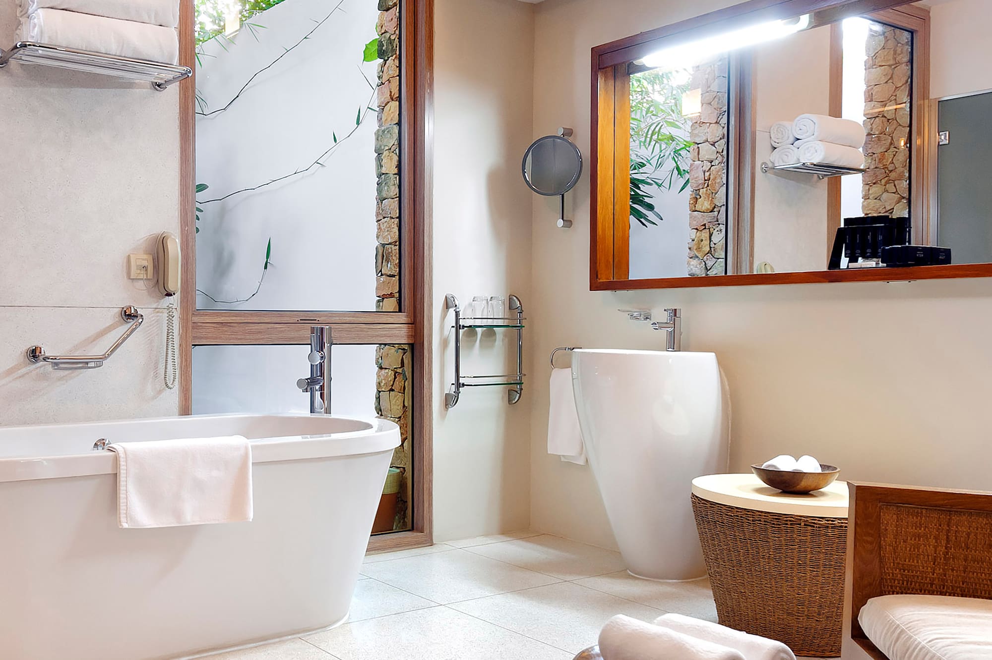 a bathroom with a tub and a mirror