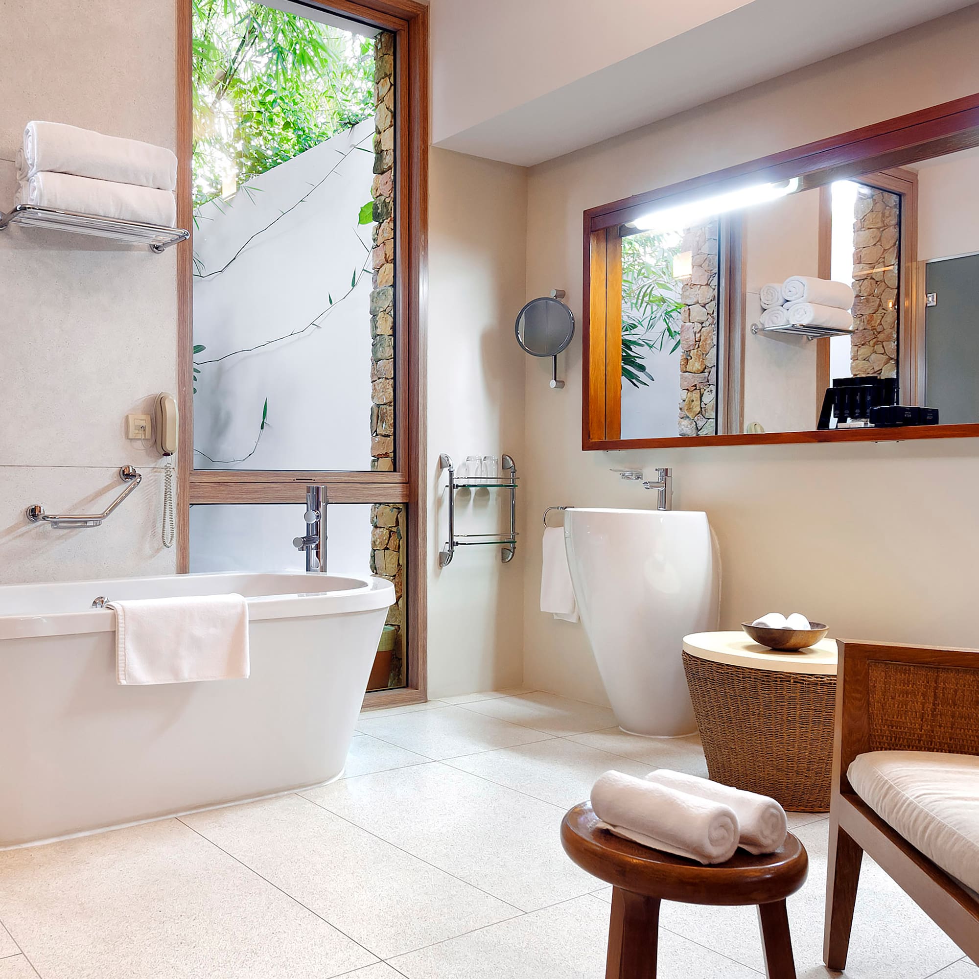 a bathroom with a tub and a mirror