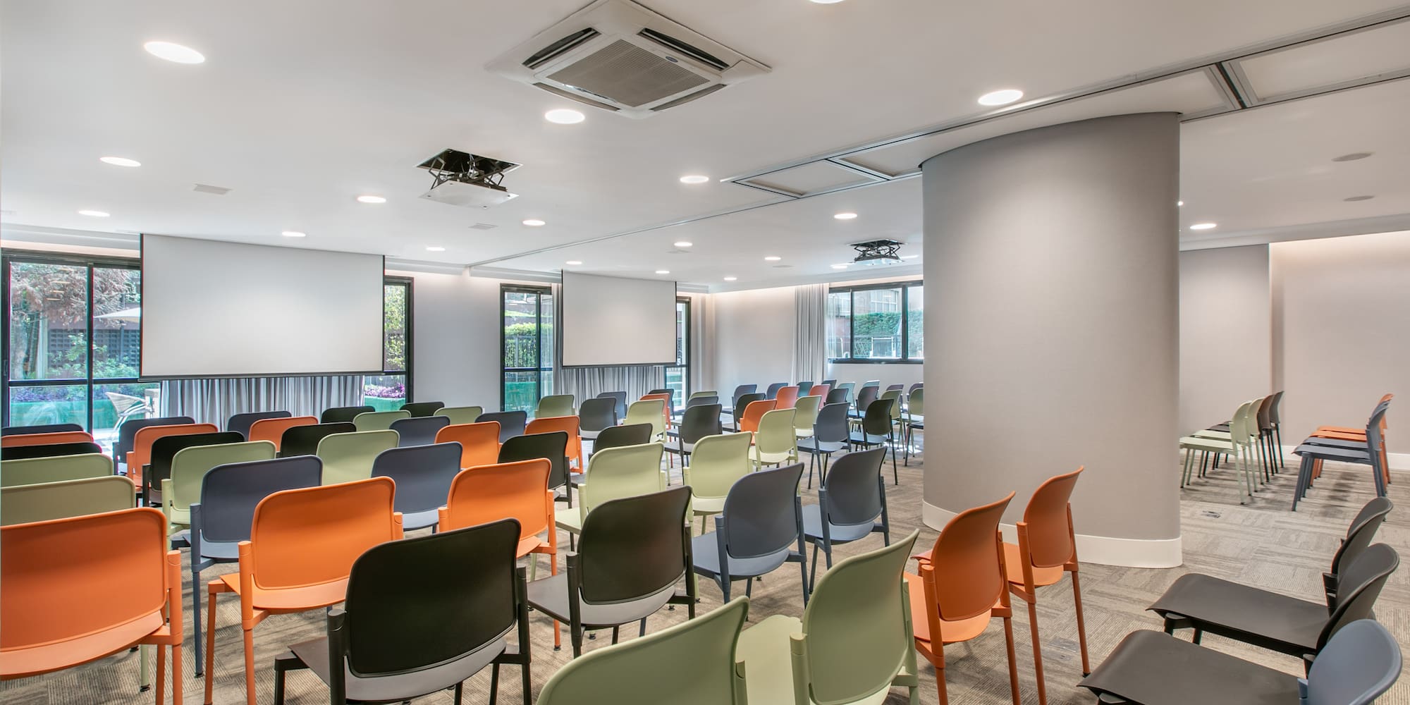 a room with many chairs and tables