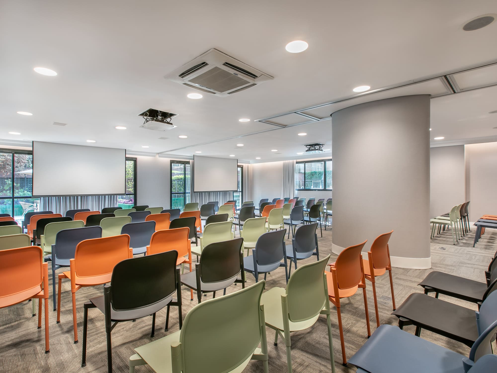 a room with many chairs and tables