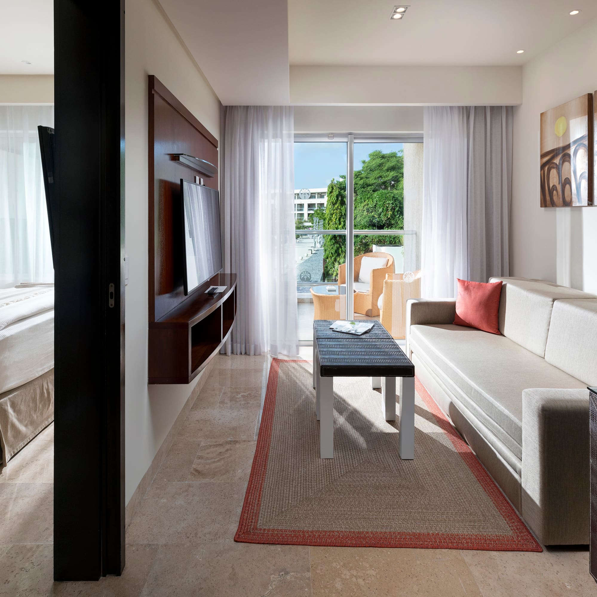 a living room with a couch and a tv