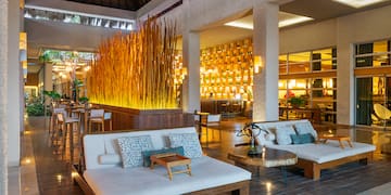 a room with a large wall and a large couch