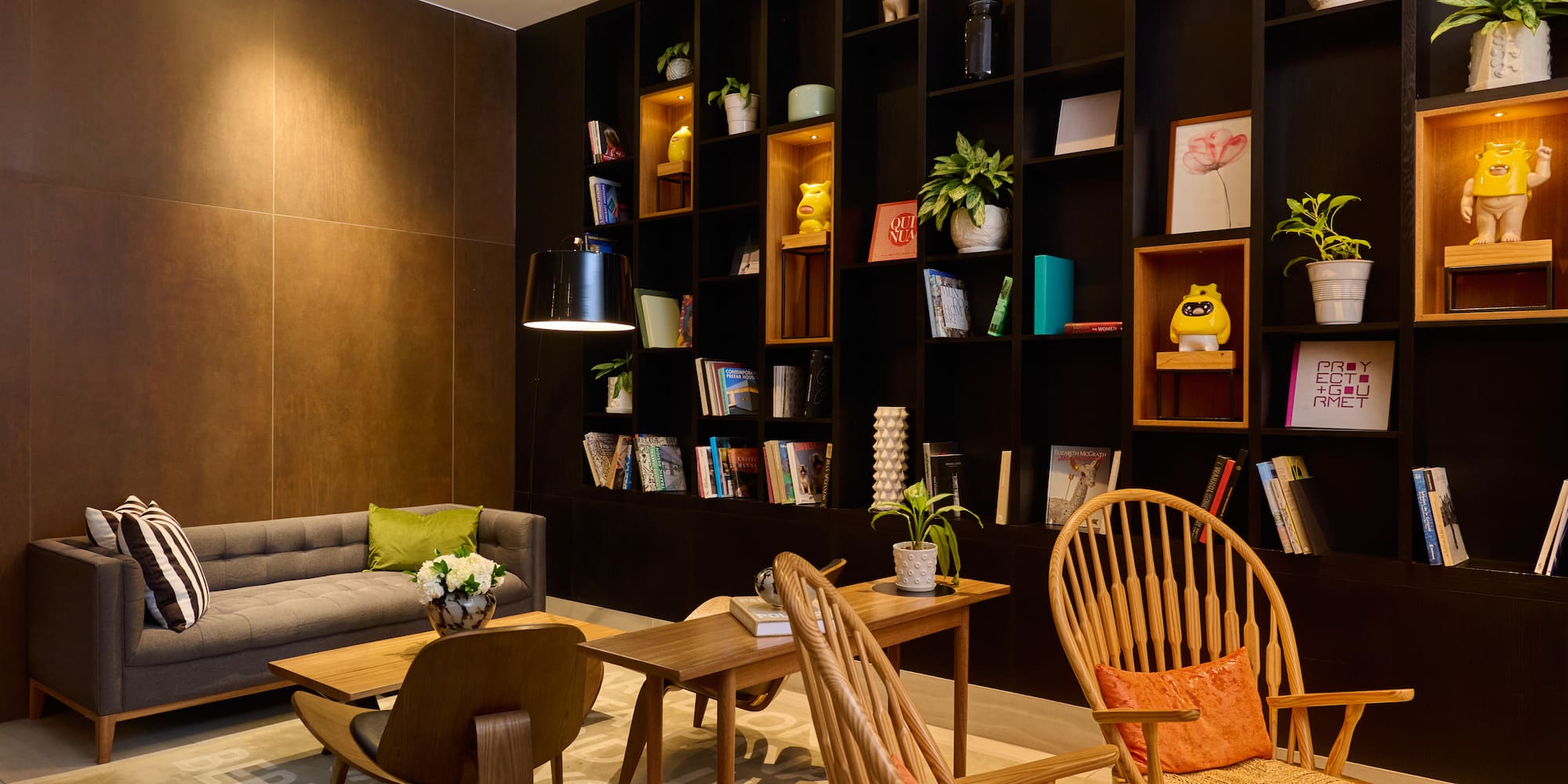 a room with a couch and chairs