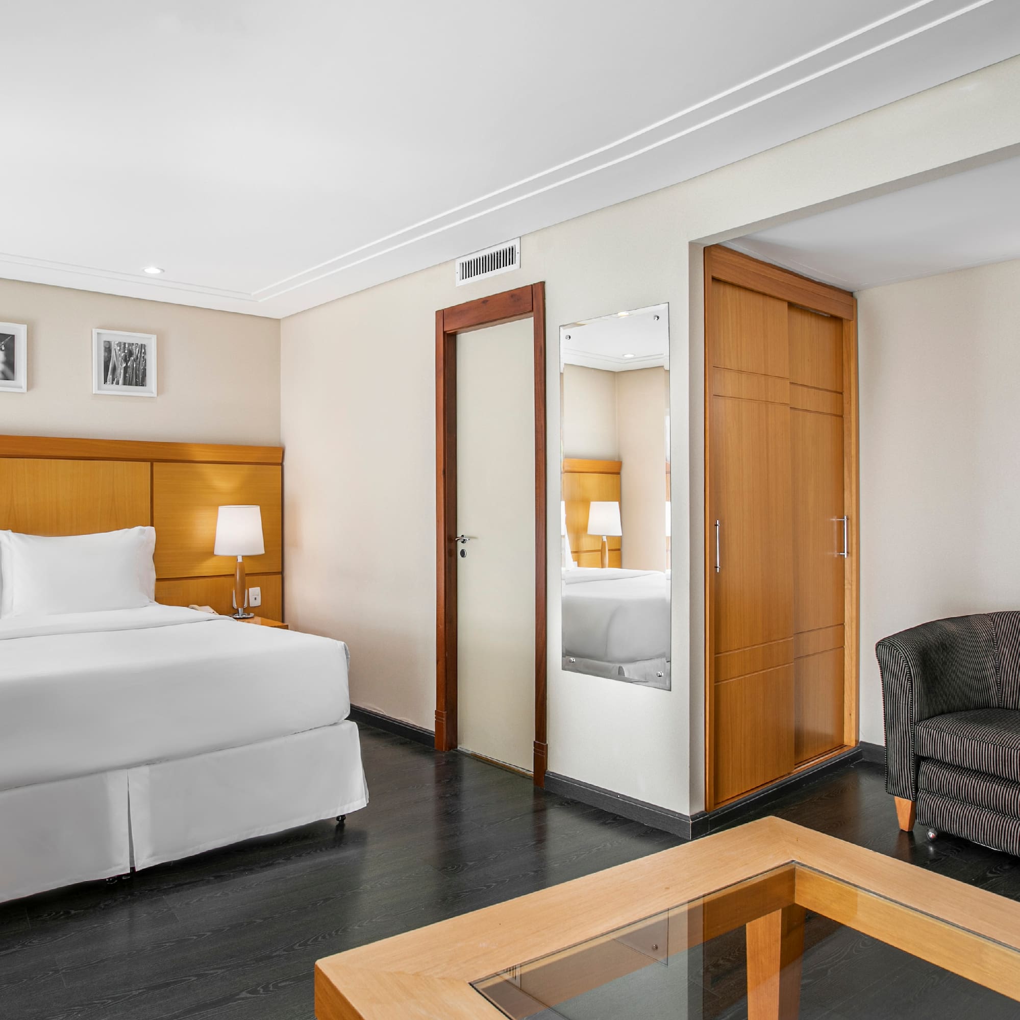 a room with a bed and a coffee table