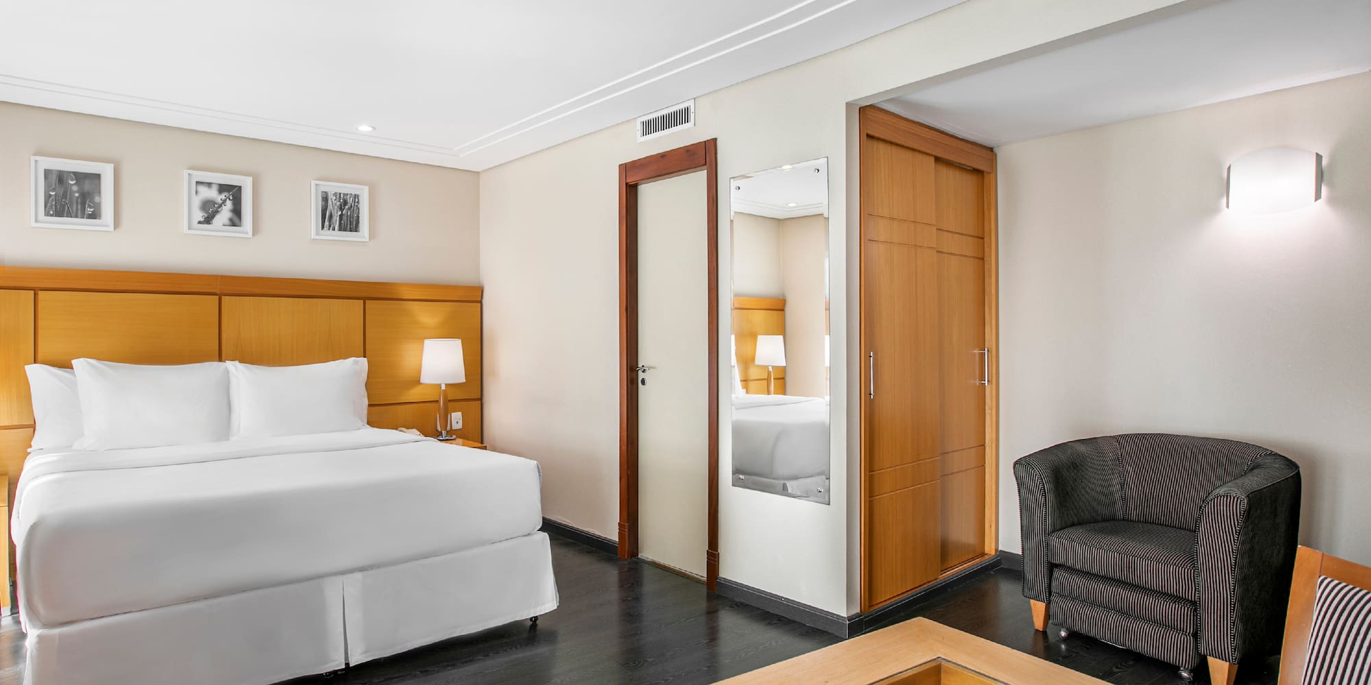 a room with a bed and a coffee table