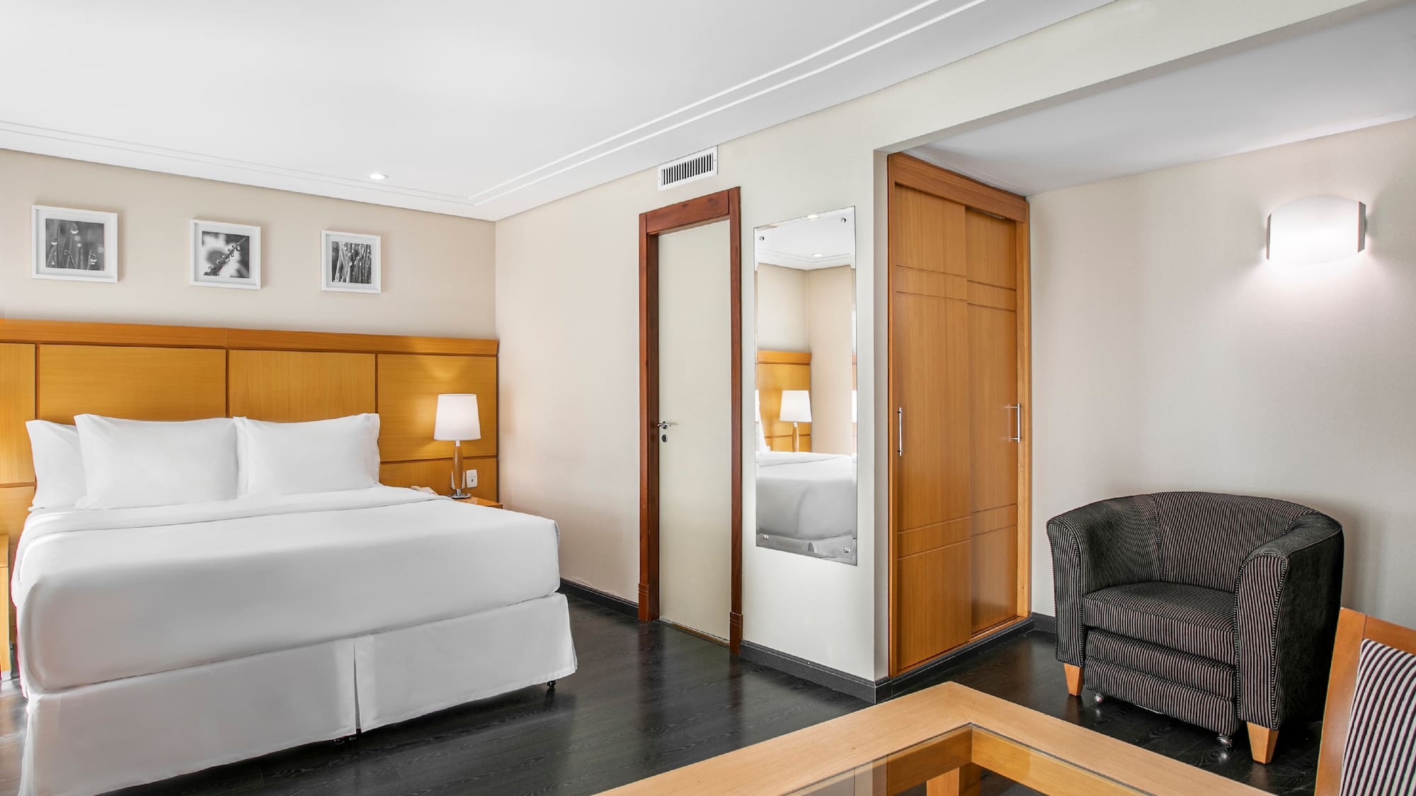 a room with a bed and a coffee table