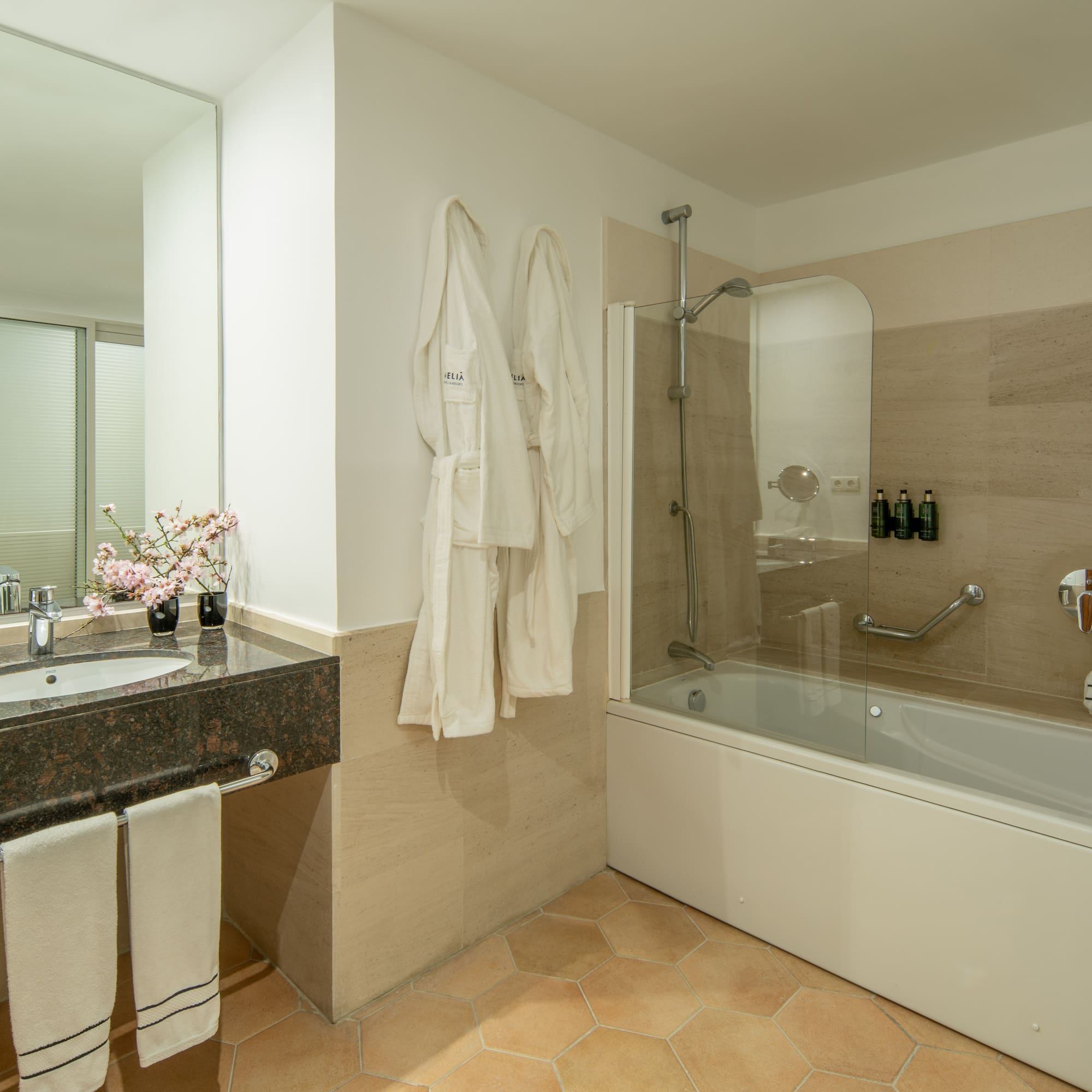 a bathroom with a bathtub and sink