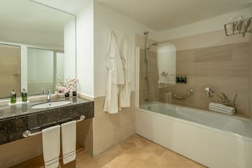 a bathroom with a bathtub and sink