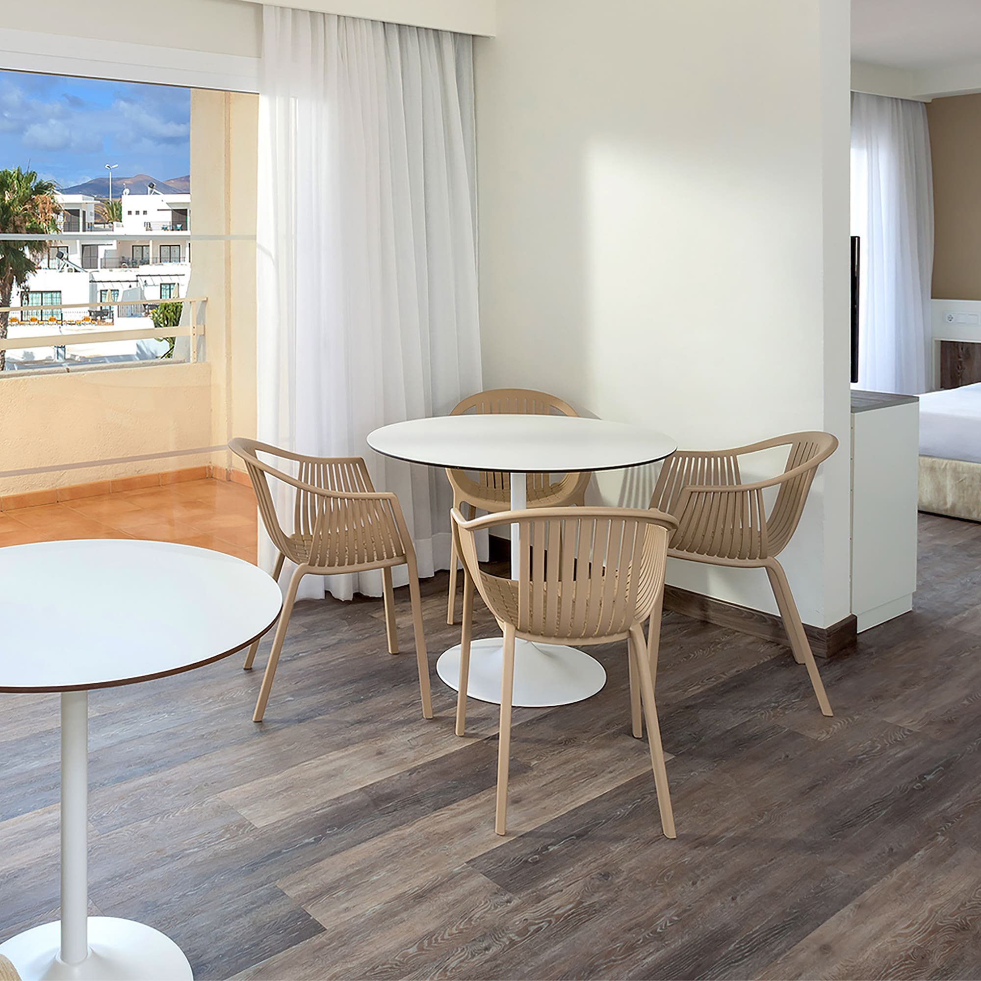 a room with a table and chairs