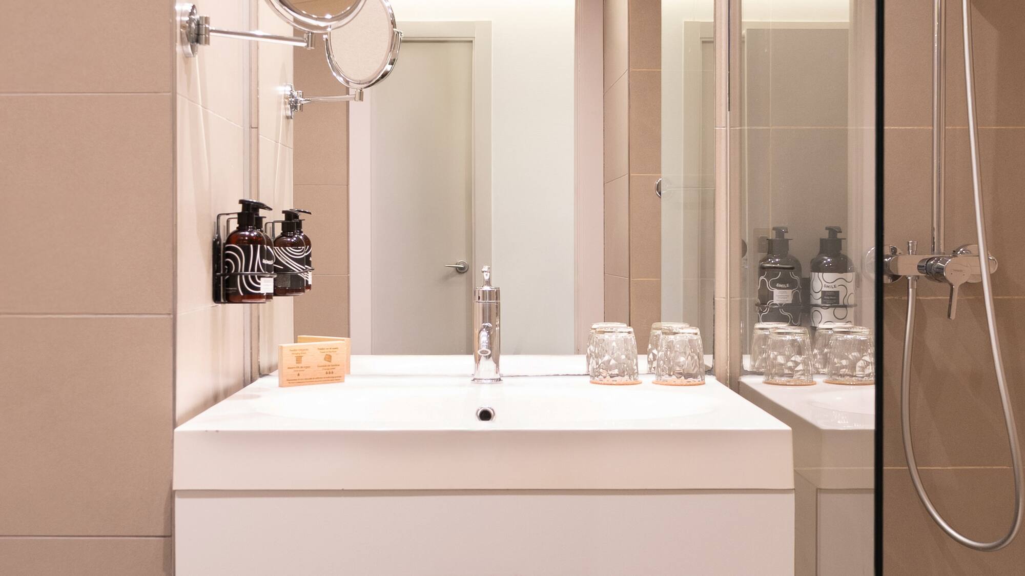 a bathroom with a shower and a sink