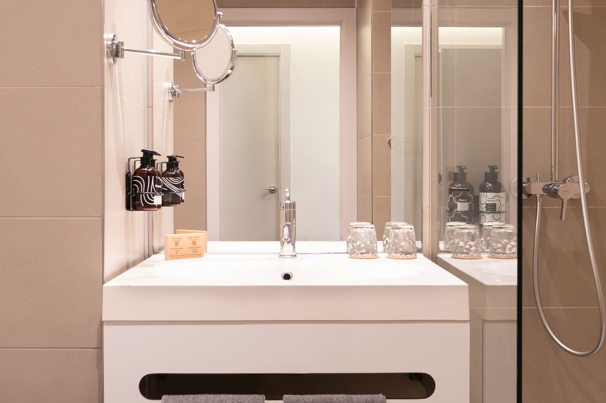 a bathroom with a shower and a sink