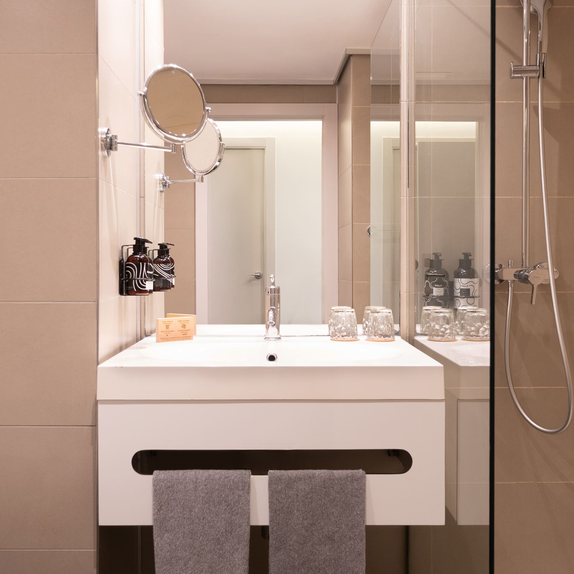 a bathroom with a shower and a sink