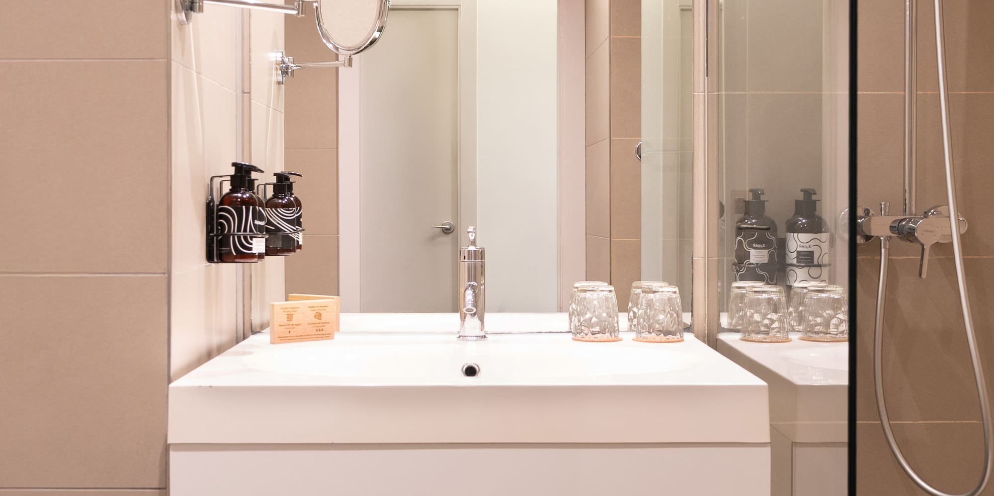 a bathroom with a shower and a sink