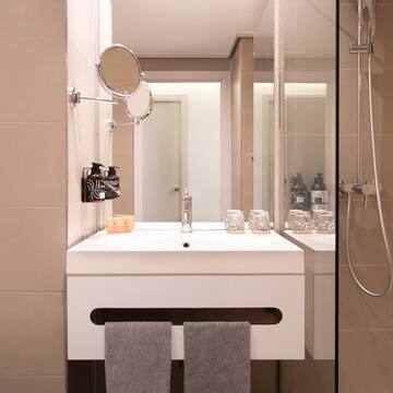 a bathroom with a shower and a sink