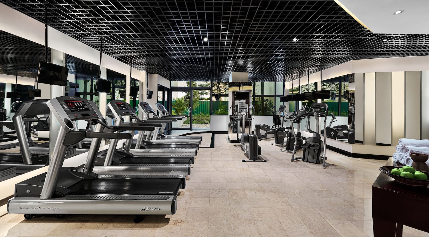 a room with treadmills and exercise equipment