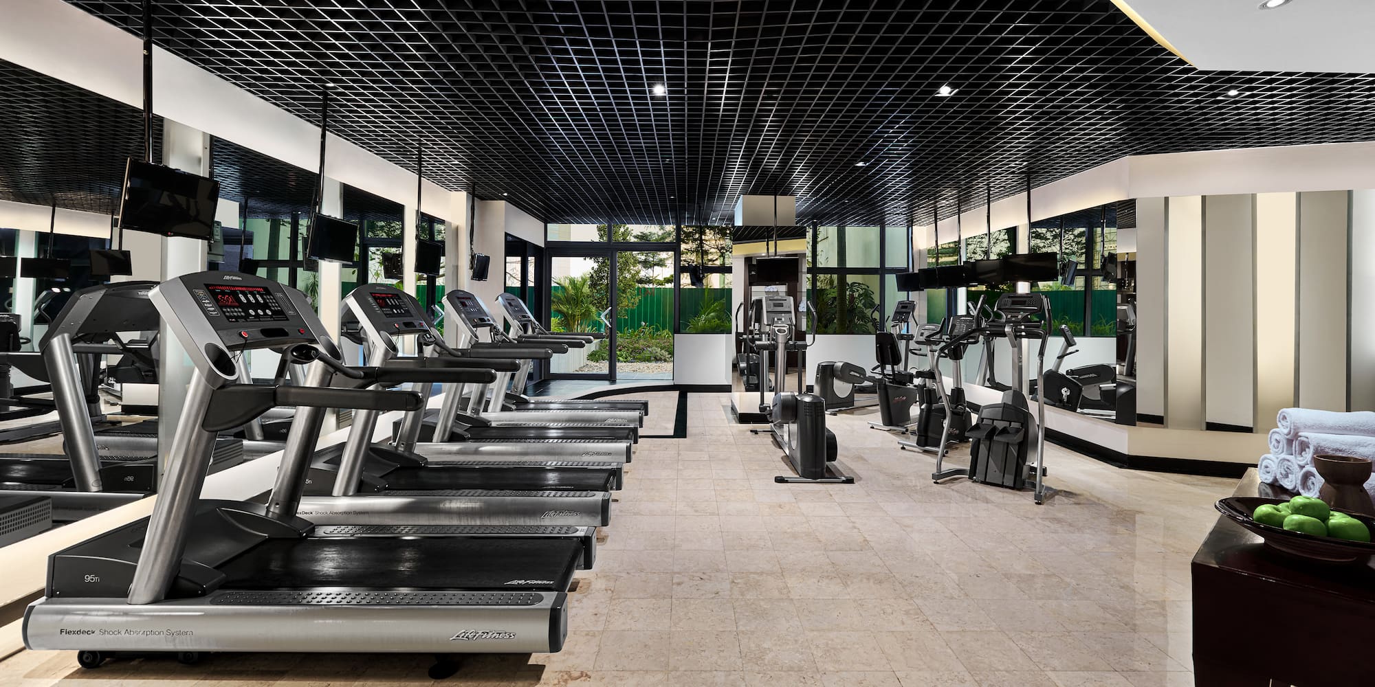 a room with treadmills and exercise equipment