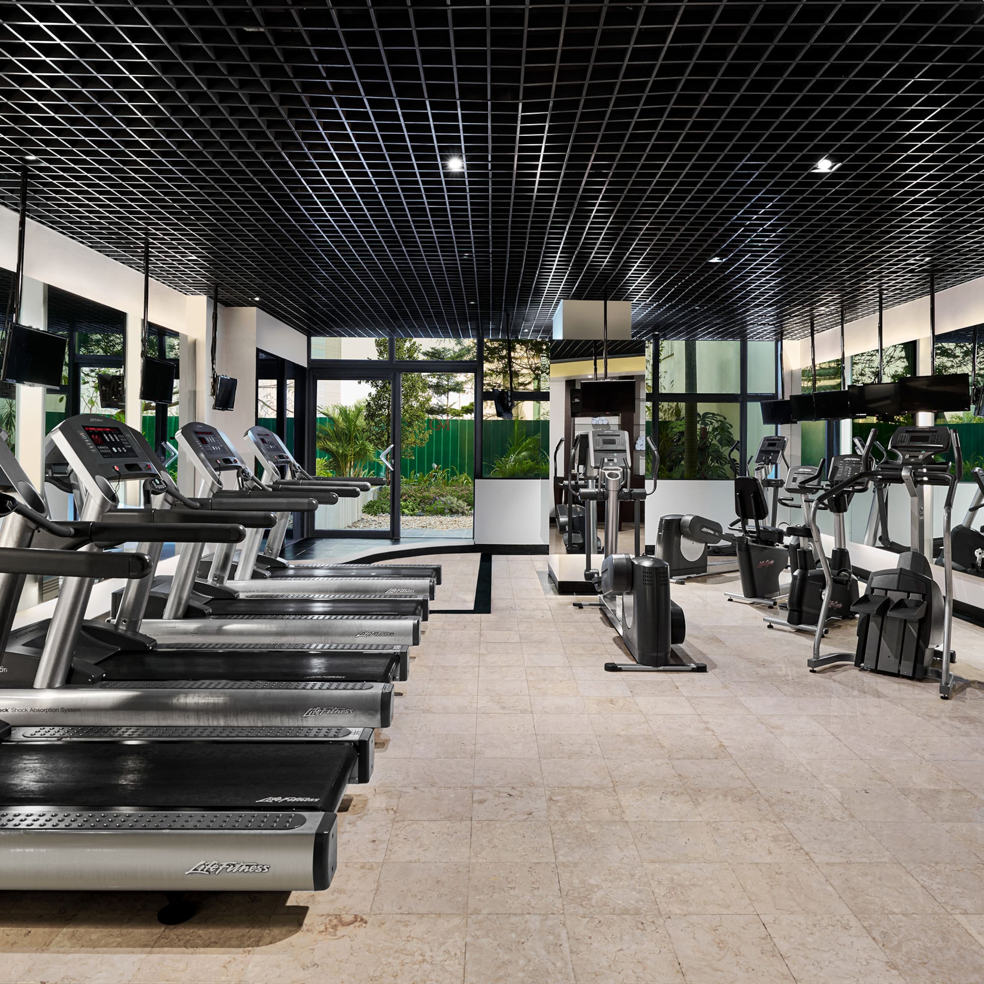 a room with treadmills and exercise equipment