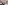 Modern bathroom: double black marble vanity, terracotta tiles, glass shower.