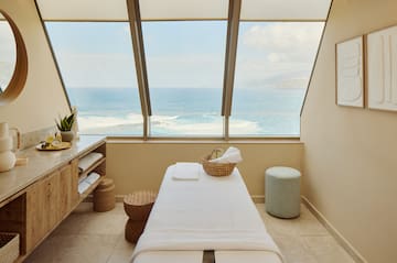 a massage table with a basket and a basket on it