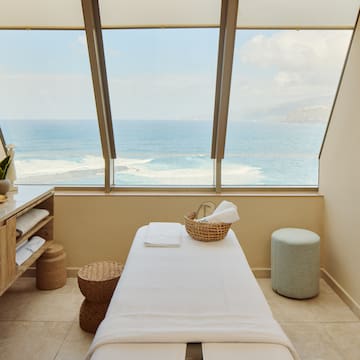 a massage table with a basket and a basket on it