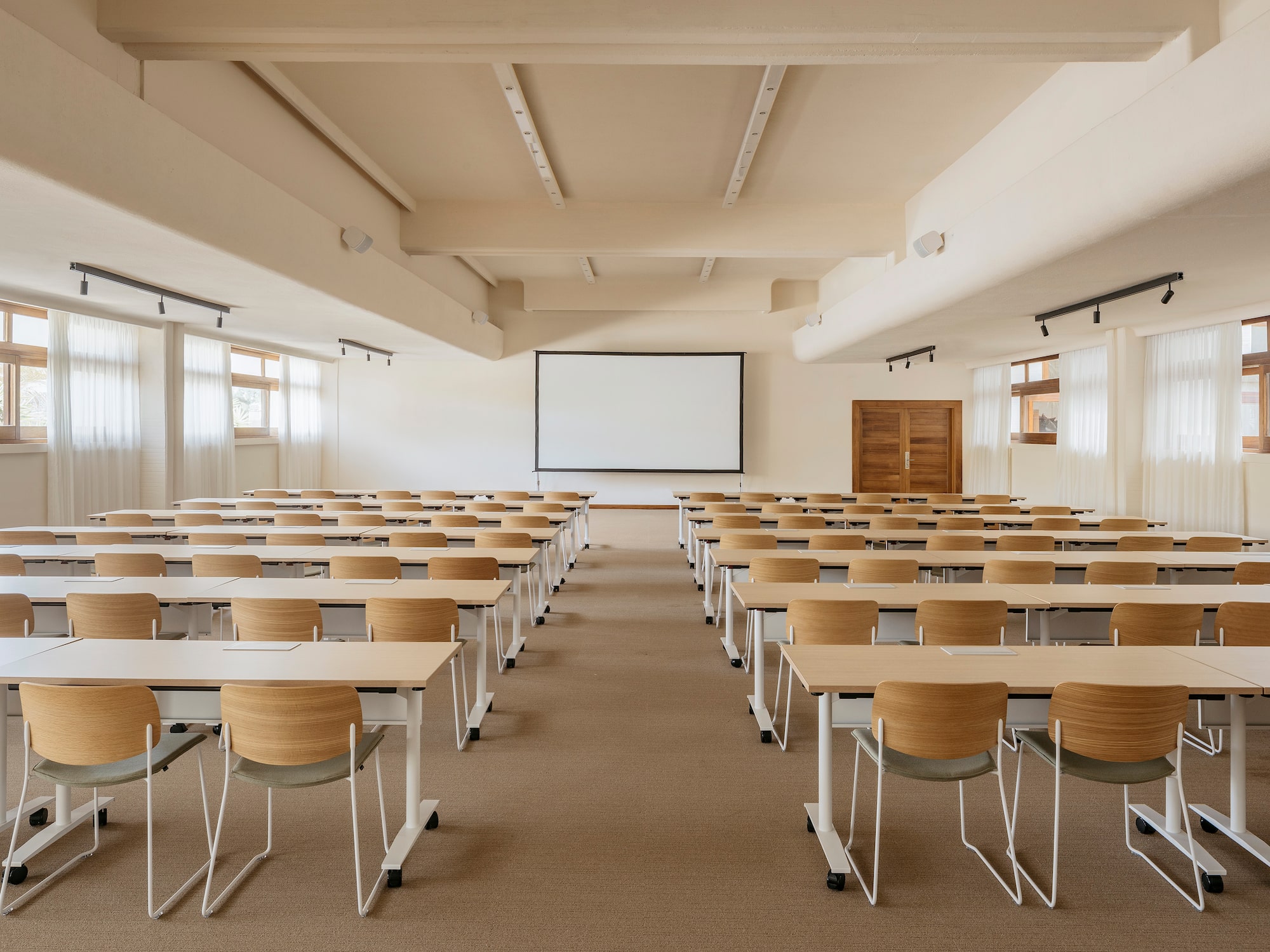a room with desks and chairs.