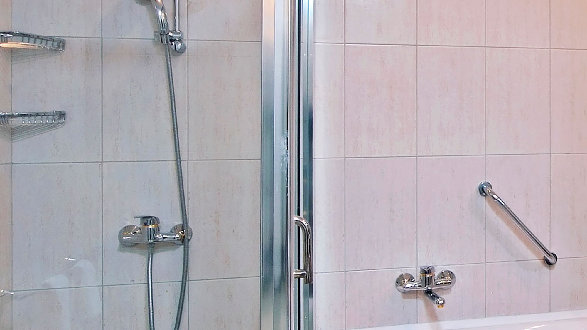 a bathroom with a shower and bathtub