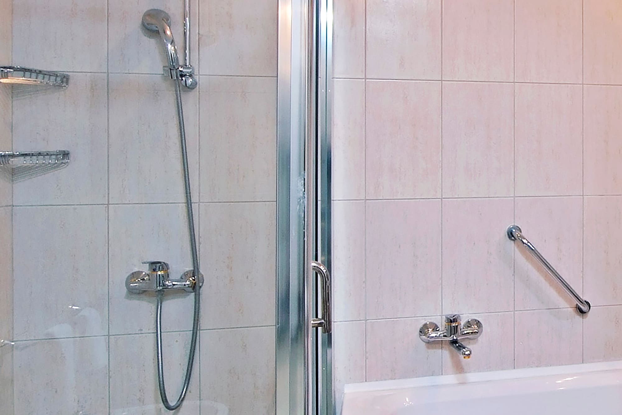 a bathroom with a shower and bathtub