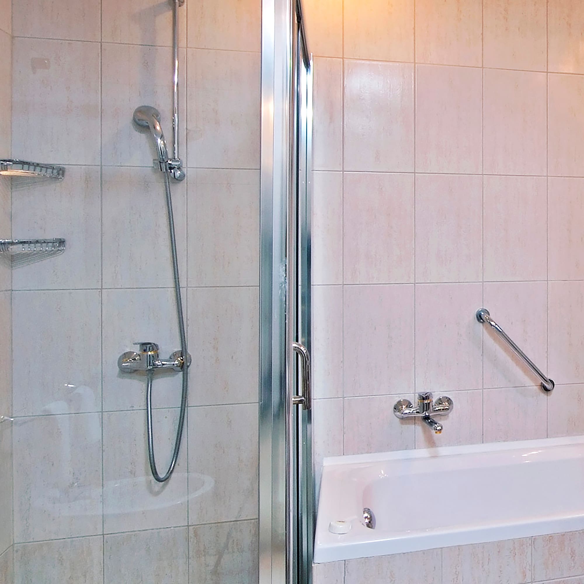 a bathroom with a shower and bathtub
