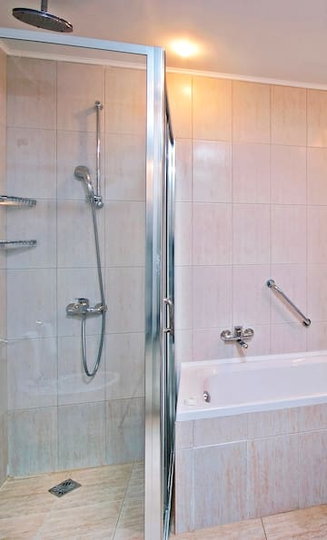 a bathroom with a shower and bathtub
