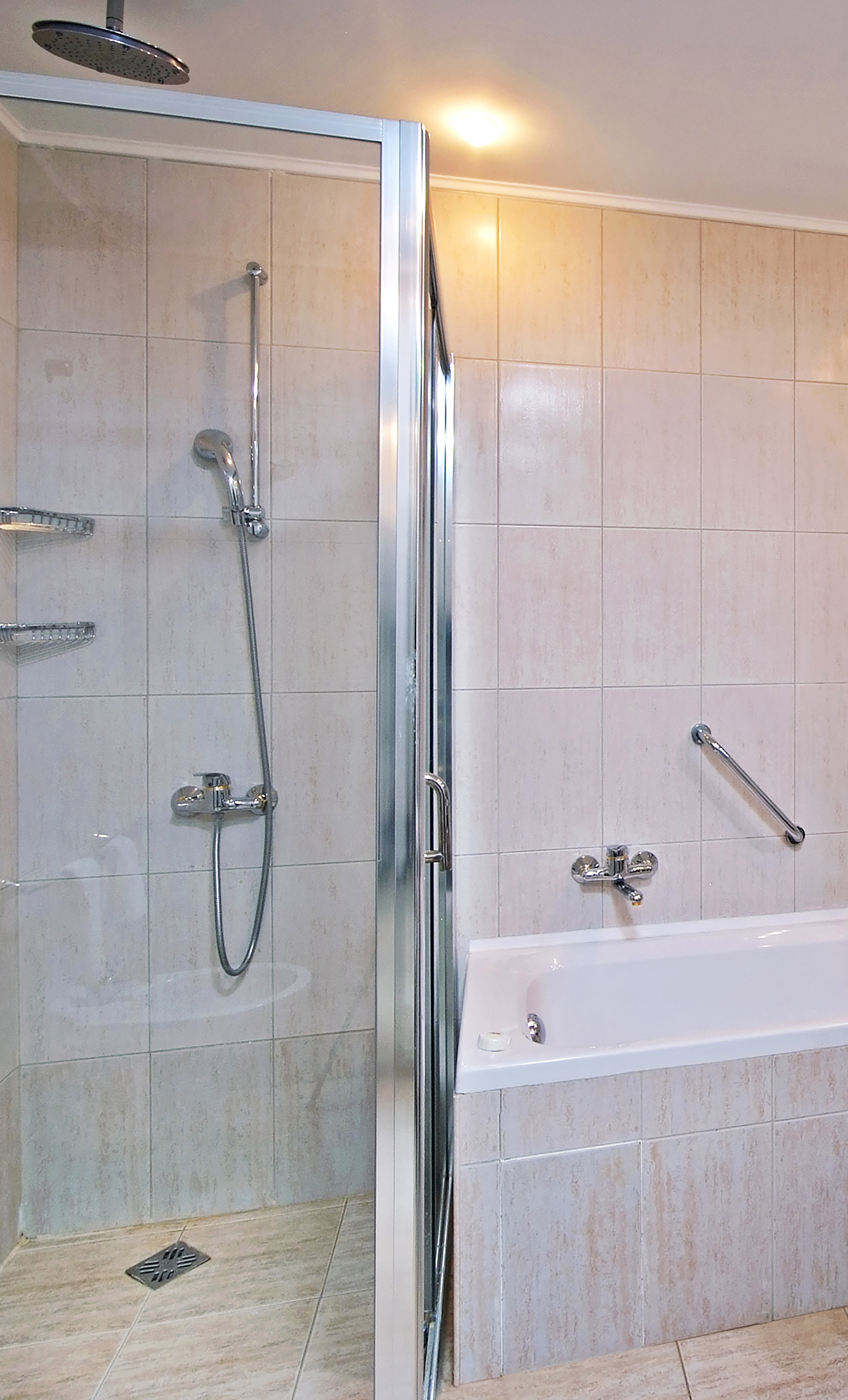 a bathroom with a shower and bathtub