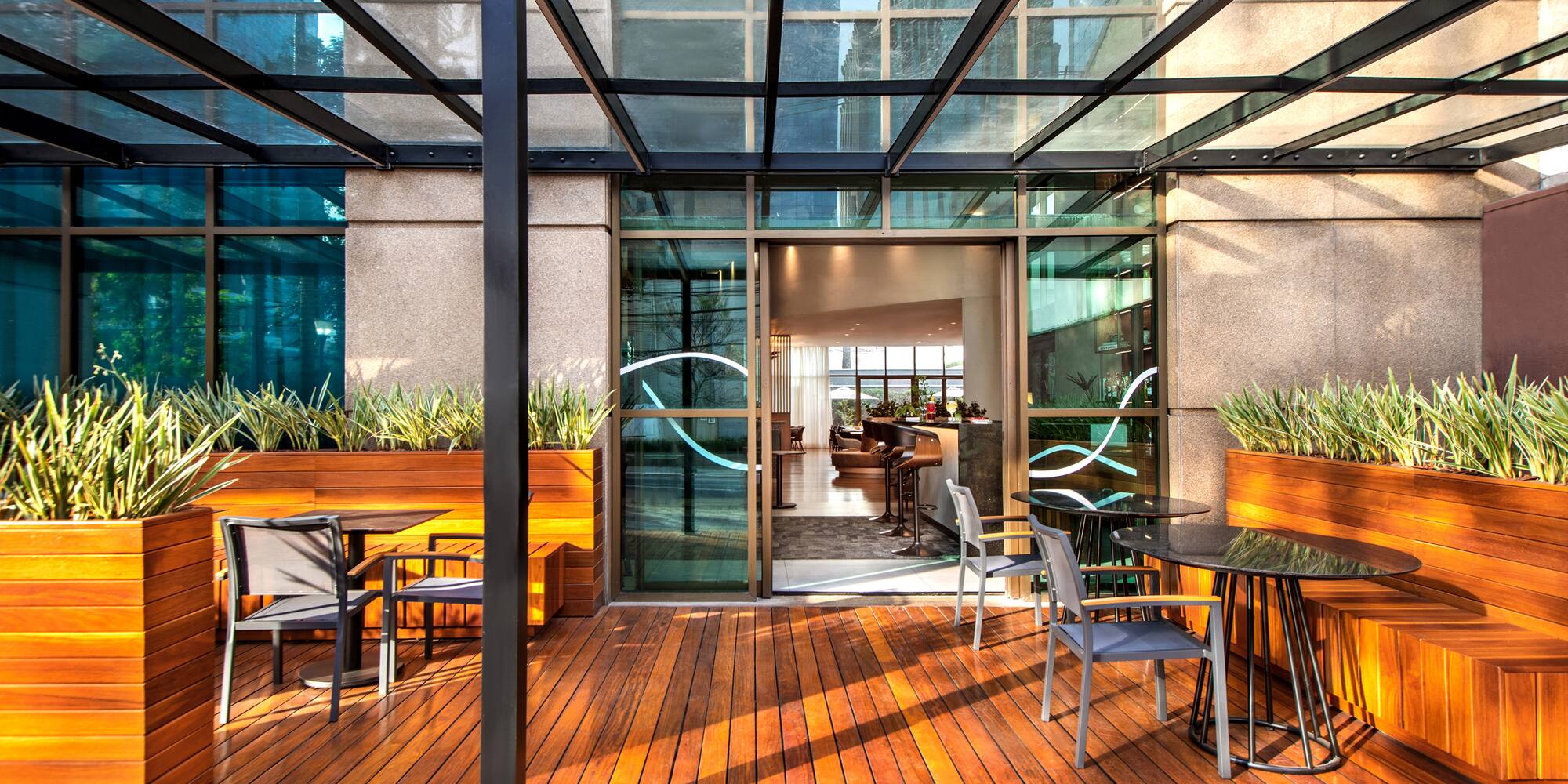 a patio with a glass roof