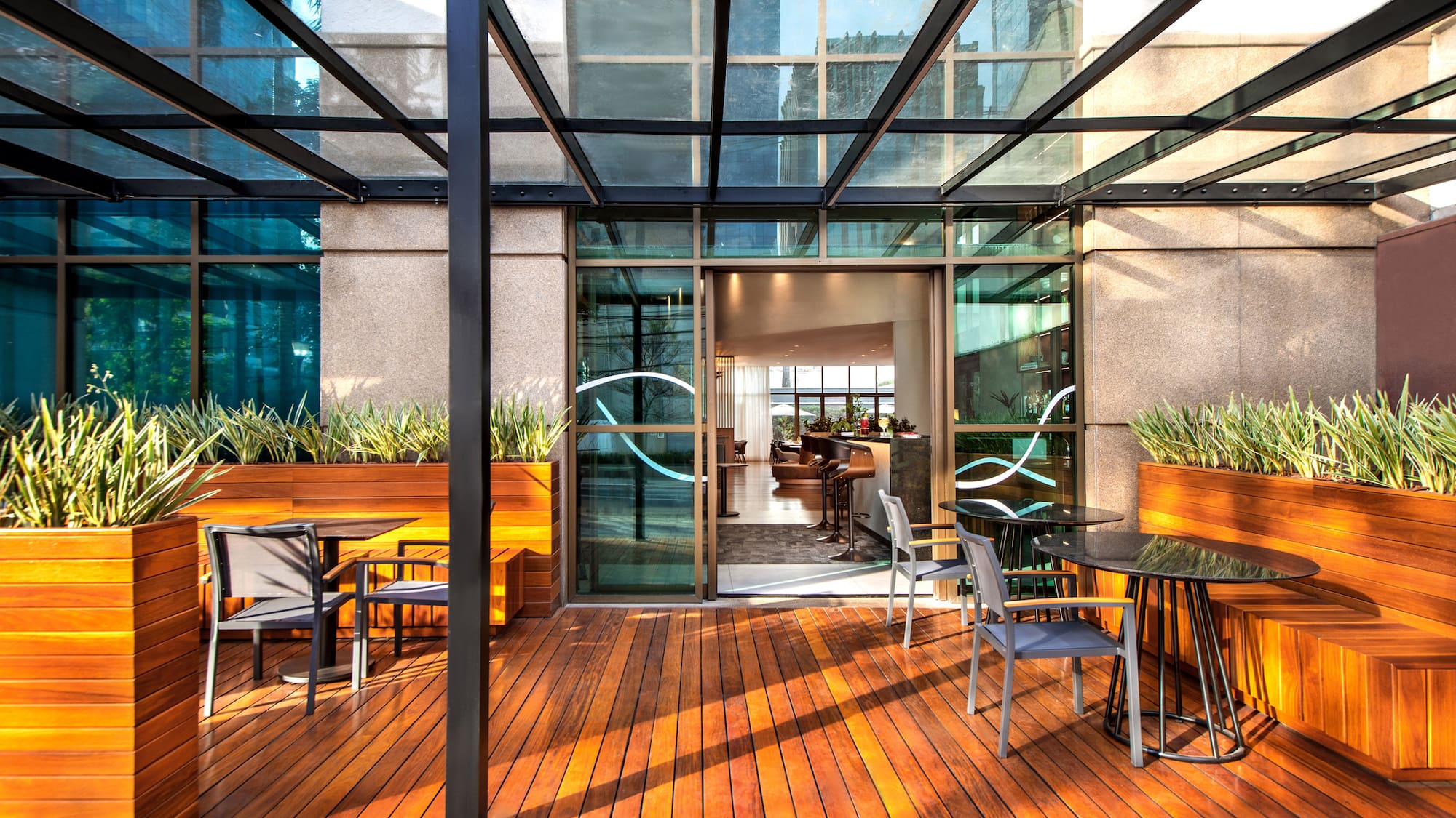 a patio with a glass roof