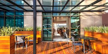 a patio with a glass roof