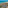 Balcony view over turquoise ocean, white sand beach, and coastal resort.