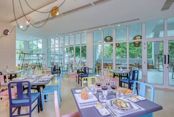 a restaurant with many tables and chairs