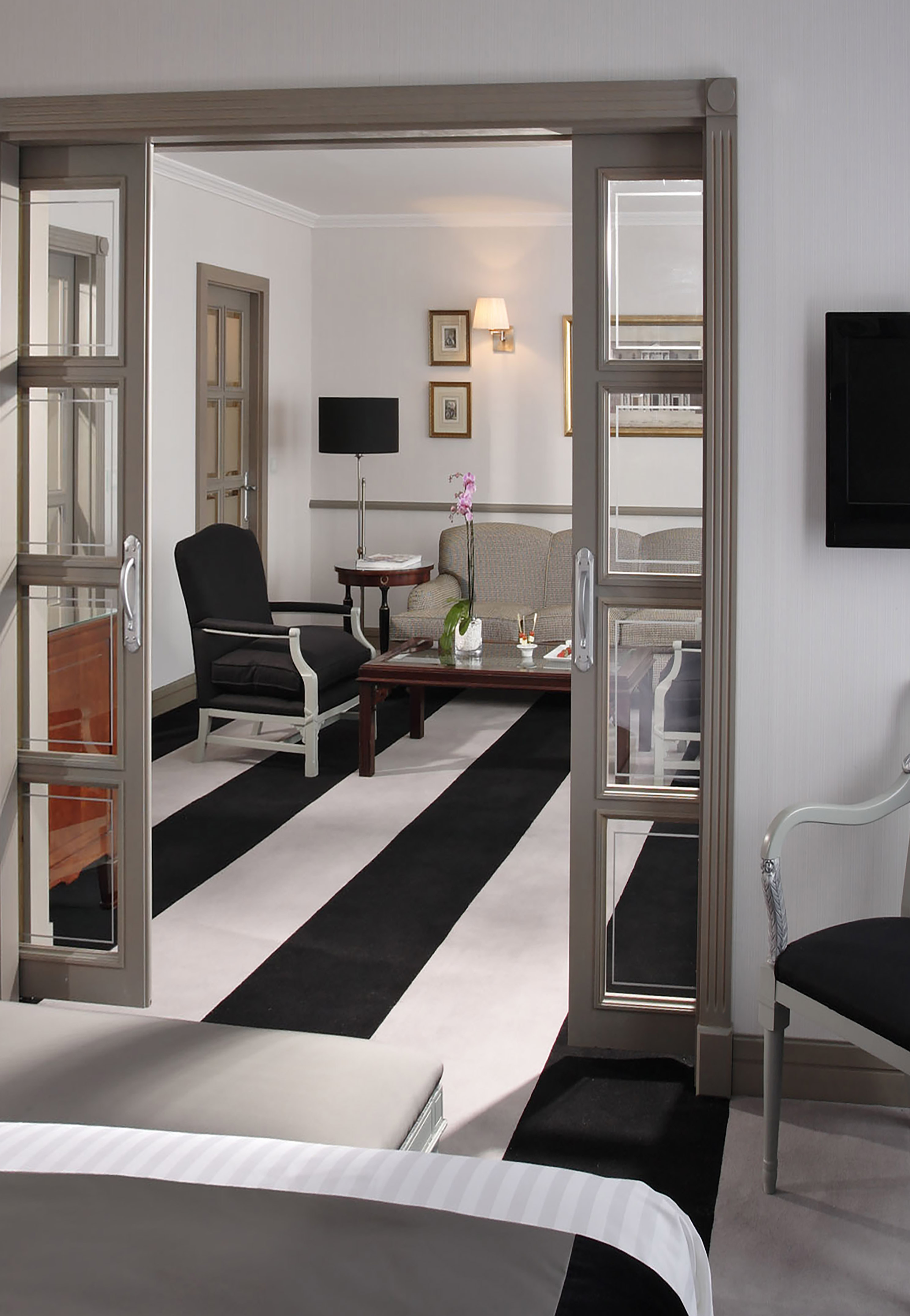 a room with a black and white striped carpet