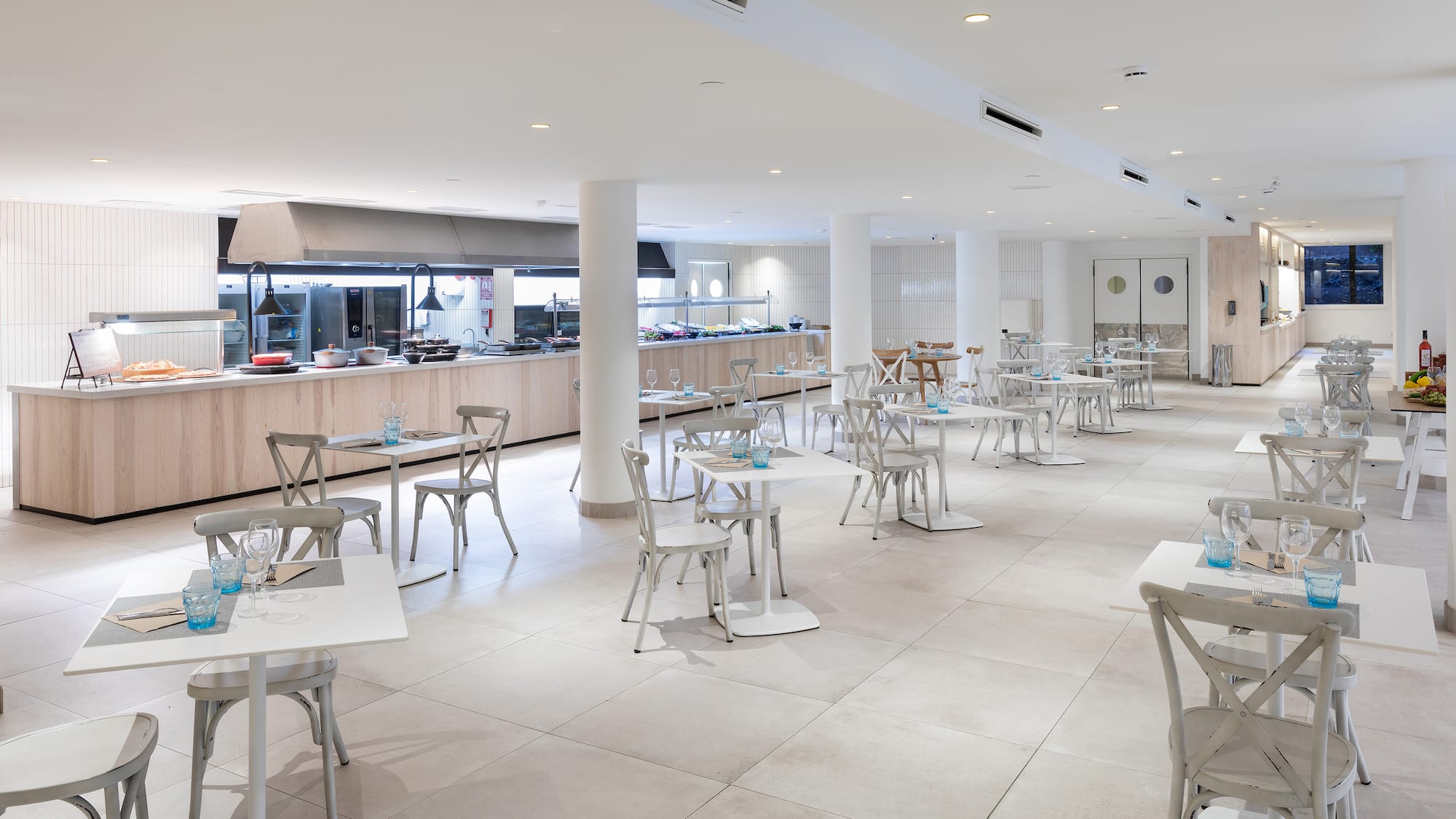 a large room with tables and chairs