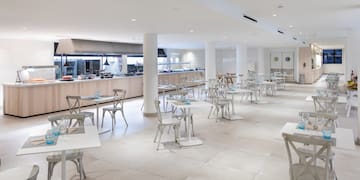 a large room with tables and chairs