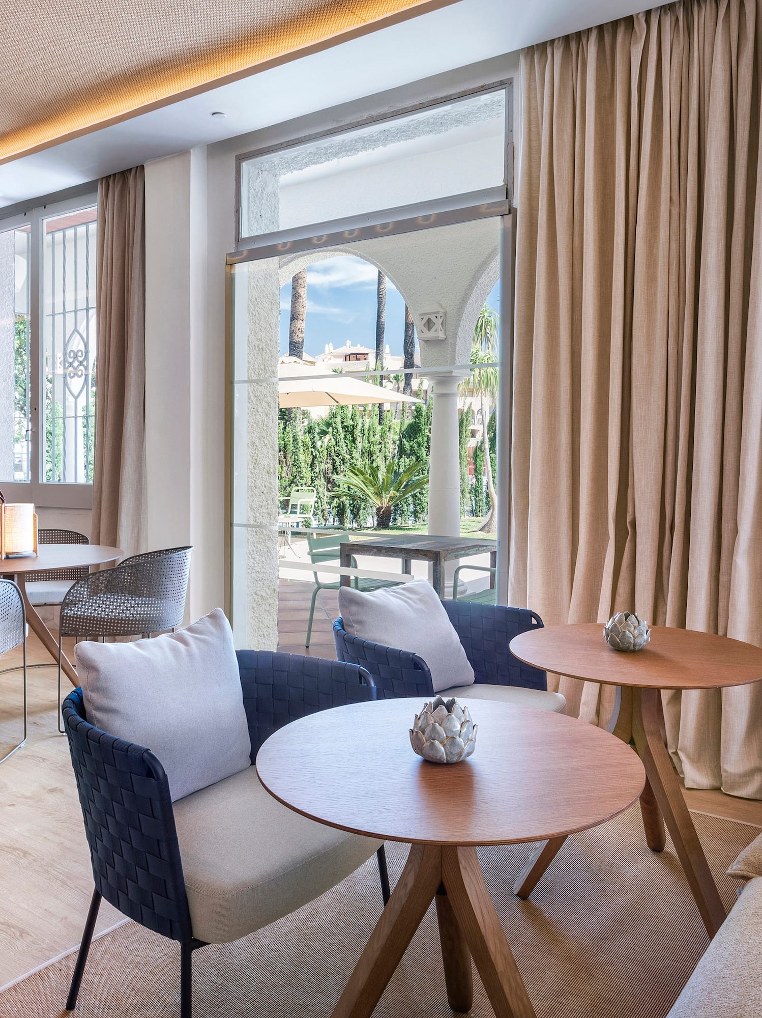 a room with a couch and tables