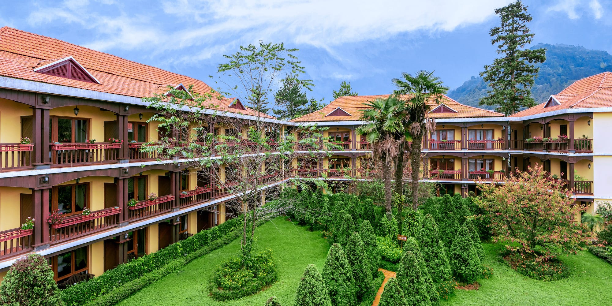 a building with trees and bushes