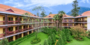 a building with trees and bushes