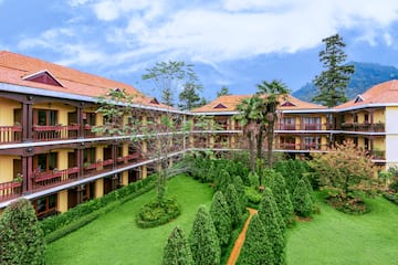 a building with trees and bushes