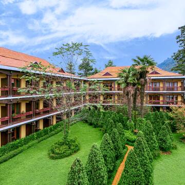 a building with trees and bushes